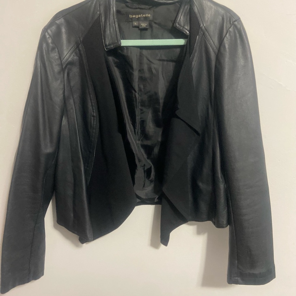 Faux Leather jacket with fabric detail.  Size xl.